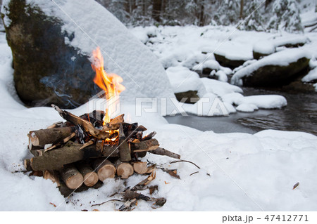 Campfire on snow in the winter forest 47412771