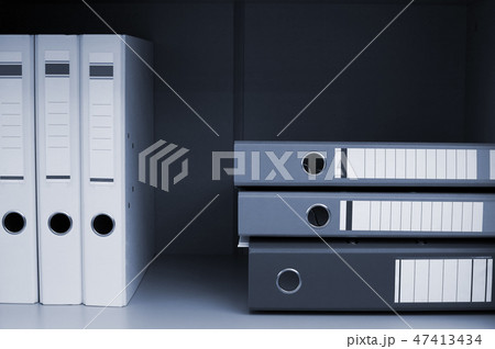 Folders for documents on book shelf 47413434
