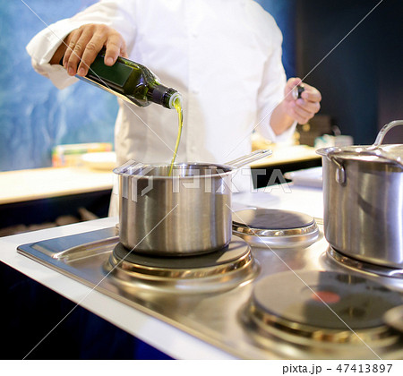Chef cooking food in the kitchen, preparing food 47413897