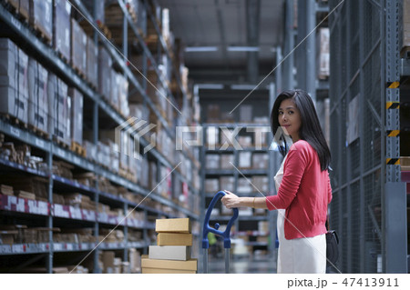 Asia woman carrying shop cart for shopping 47413911