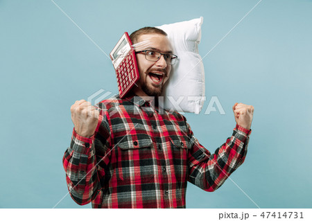 Tired man sleeping at home having too much work. Bored businessman with pillow Tired man sleeping at home having too much work. Bored businessman with pillow 47414731