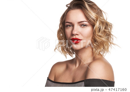Beautiful stylish woman with red lips looking at camera 47417160