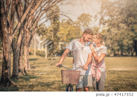 Portrait of Young couple enjoying in the park Portrait of Young couple enjoying in the park 47417352