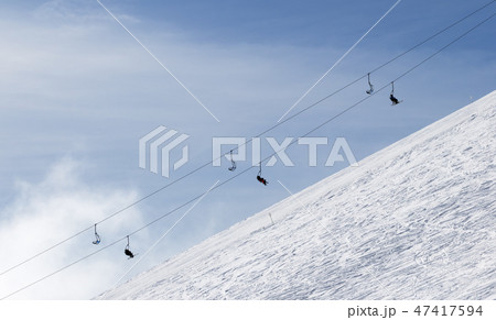 Snowy off-piste ski slope with traces from skis Snowy off-piste ski slope with traces from skis 47417594