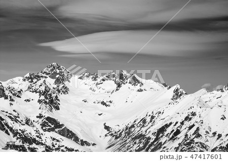 Black and white snowy winter mountains and sky Black and white snowy winter mountains and sky 47417601