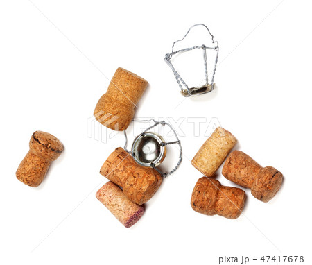 Corks from champagne wine and muselets on white Corks from champagne wine and muselets on white 47417678