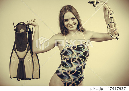 Woman with flippers and snorkeling mask having fun 47417927