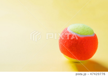 Tennis Ball on yellow Background, Sport Concept Tennis Ball on yellow Background, Sport Concept 47420776