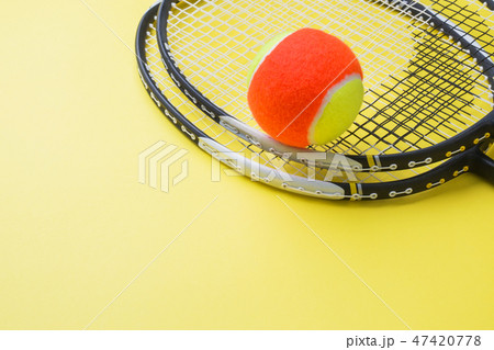 Tennis Ball and rackets on yellow Background, Tennis Ball and rackets on yellow Background, 47420778