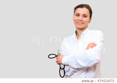 Smiling female doctor therapist with stethoscope. Smiling female doctor therapist with stethoscope. 47421073