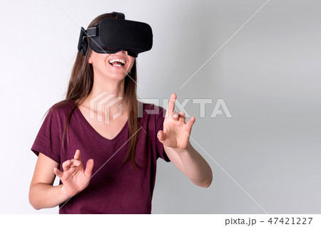 Young woman wearing virtual reality goggles headset, vr box. Connection, technology, new generation 47421227