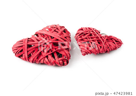Two red hearts made of straw, isolated on white 47423981