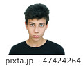 A teenager in a black shirt on a white background 47424264