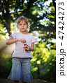 Girl playing in the park 47424273