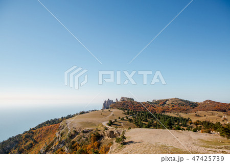 Image of picturesque mountain area, cloudy sky, road 47425739