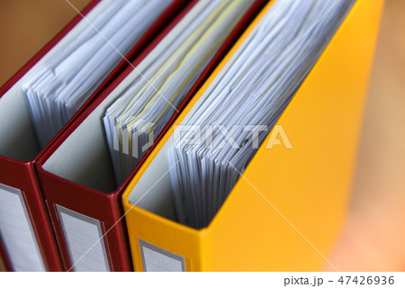 Folders for documents on the table in office 47426936