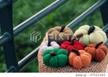 colorful pumpkin ornament on outside table 47432382