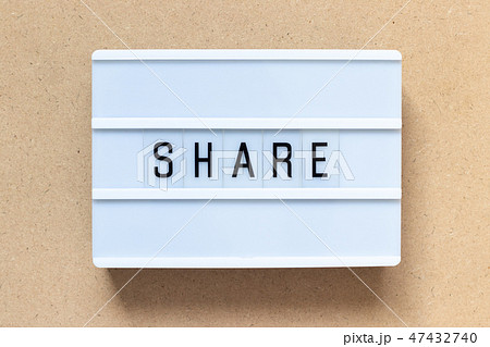 White lightbox with word share on wood background White lightbox with word share on wood background 47432740