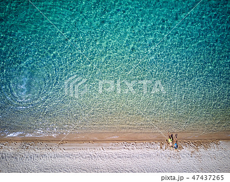 Beautiful beach with family drone shot 47437265