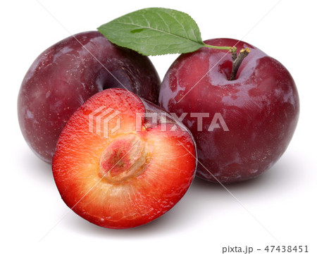 Red plums with leaf on white background Red plums with leaf on white background 47438451