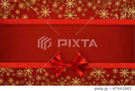 Silk ribbon and a bow on red paper Silk ribbon and a bow on red paper 47441665
