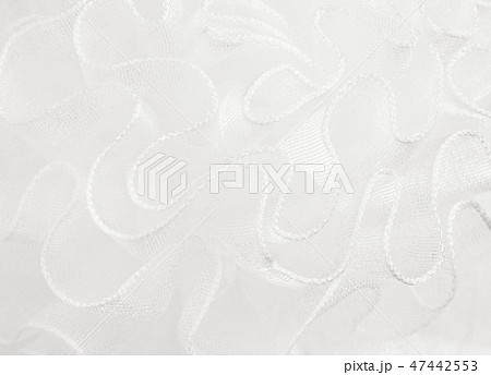 Closeup of white waved organza texture Closeup of white waved organza texture 47442553