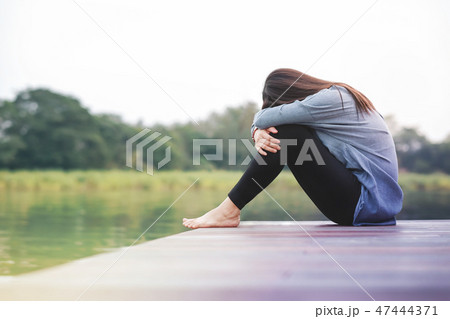 Bad Day Concept.Sadness Woman Sitting by the River 47444371