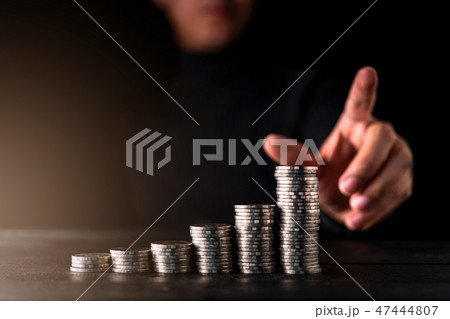 businessman hand point money coin stack businessman hand point money coin stack 47444807