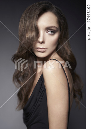 Fashion photo of beautiful lady in black dress. Fashion photo of beautiful lady in black dress. 47448109
