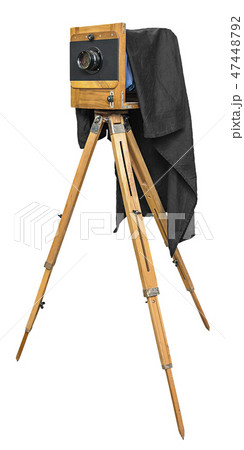 old wooden camera on a tripod isolated on white  47448792