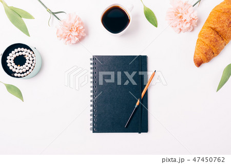 Closed black sketchbook and pencil Closed black sketchbook and pencil 47450762