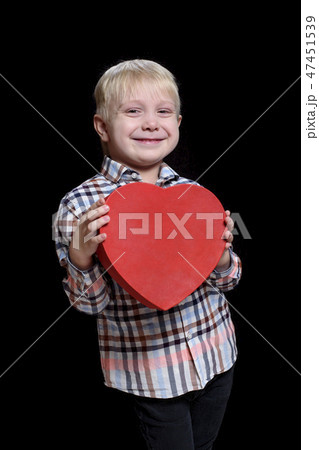 Smiling blond boy in checkered shirt 47451539