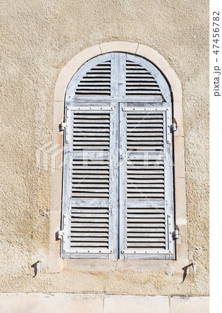 Old ancient window shutters of a mediterranean house, vintage background. 47456782