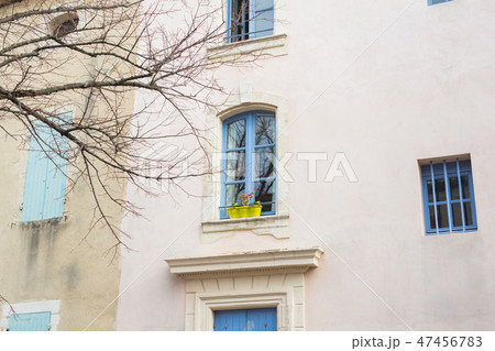 Design, architecture and exterior concept - Blue window with flower pot on the white facade Design, architecture and exterior concept - Blue window with flower pot on the white facade 47456783