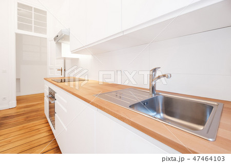 kitchen sink water tap in new white kitchenette  47464103