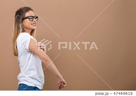 Young woman scratching her itchy arm. 47469619