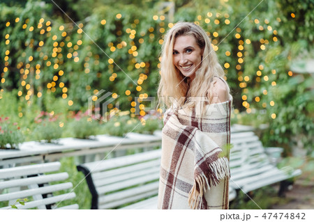 Beautiful girl posing in the park at the camera 47474842