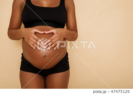 Unrecognizable pregnant woman  47475120