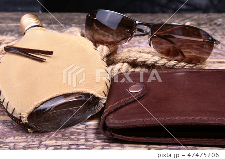 Stylish mens business accessories. Watch, wallet, bottle with cologne on wooden background. 47475206
