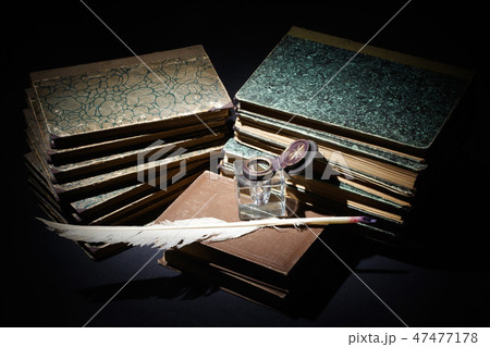 old books, papers, ink pen and inkpot 47477178