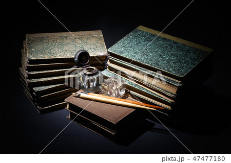 old books, papers, ink pen and inkpot 47477180