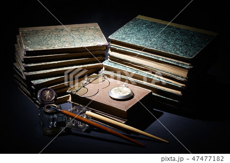 old books, papers, ink pen and inkpot 47477182
