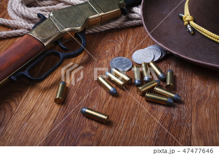 Wild west rifle, ammunition and silver dollars Wild west rifle, ammunition and silver dollars 47477646