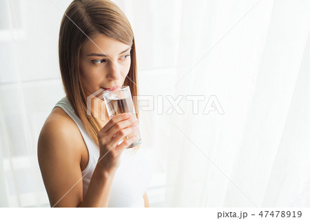 Healthy Lifestyle. Close-up Portrait Of Young Woman Drinking Refreshing Pure Water From Glass 47478919