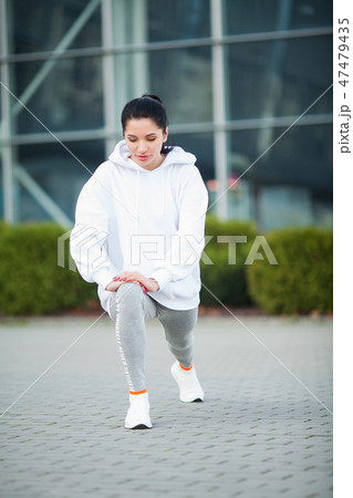 Fitness. Beautiful young woman exercising in the park - Sport and healthy lifestyle concept 47479435