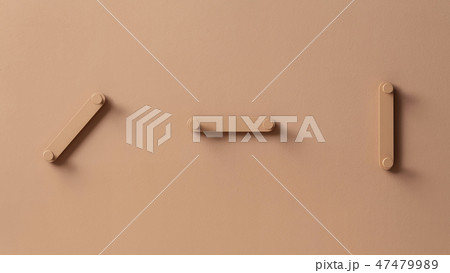 Fancy coral metal hangers on colorful wall in studio 47479989