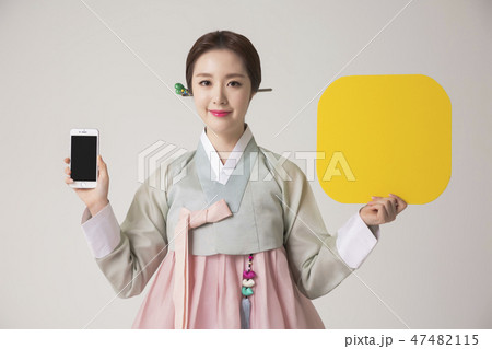 Korean beauty concept photo. Young beautiful woman wearing Hanbok, Korean traditional dress. 303 Korean beauty concept photo. Young beautiful woman wearing Hanbok, Korean traditional dress. 303 47482115