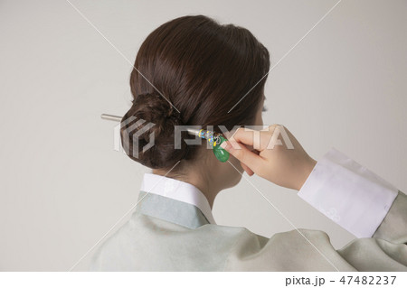 Korean beauty concept photo. Young beautiful woman wearing Hanbok, Korean traditional dress. 330 Korean beauty concept photo. Young beautiful woman wearing Hanbok, Korean traditional dress. 330 47482237
