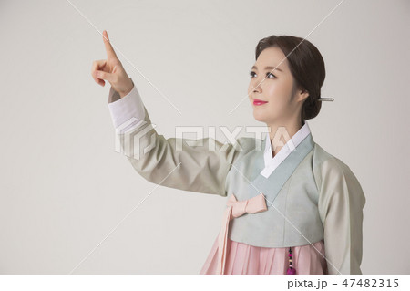 Korean beauty concept photo. Young beautiful woman wearing Hanbok, Korean traditional dress. 261 47482315