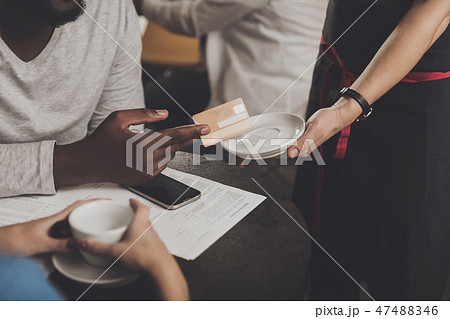 Young African American is calculated credit card Young African American is calculated credit card 47488346